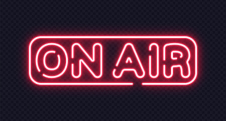 Red neon on air text inside capsule-shaped frame. Classic sign for live broadcasting, podcasts or studios.