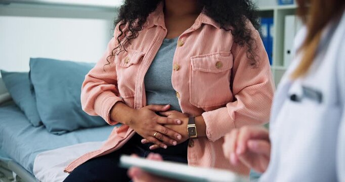 Doctor, patient and hands in office with tablet for stomach ache symptoms, typing report and diagnosis. Healthcare worker, people and conversation with tech for abdomen pain, medical advice and info.