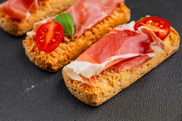 jamon bruschetta prosciutto appetizer portioned tapas dish natural tasty snack fresh delicious gourmet food background on the table rustic top view copy space