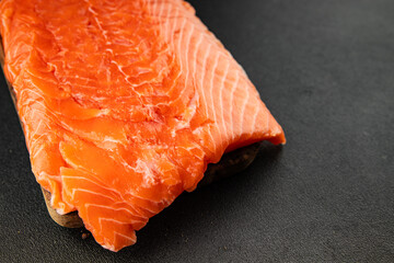 Salmon fillet raw red fish seafood dish natural tasty snack fresh delicious gourmet food background on the table rustic top view copy space pescetarian diet