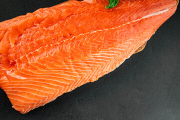 Salmon fillet raw red fish seafood dish natural tasty snack fresh delicious gourmet food background on the table rustic top view copy space pescetarian diet
