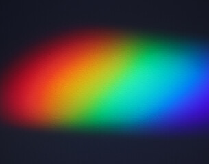 Soft focus rainbow neon grain blur texture wall with prism refraction on black. Light and shadow...
