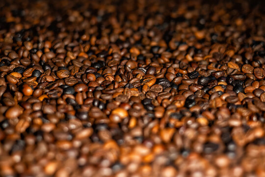Close up of roasted coffee beans background with shallow depth of field