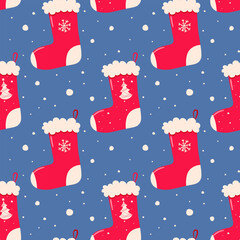 Seamless pattern from a Christmas gift sock. Red sock on a blue background.