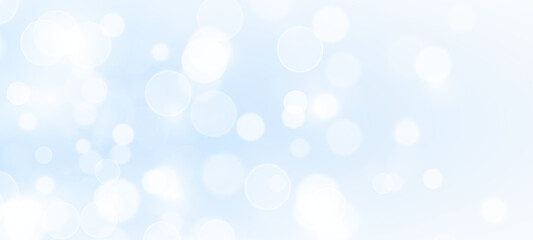 Glowing blue dust particles with luminous blur and festive sparks. Abstract stardust light texture with bright confetti accents.