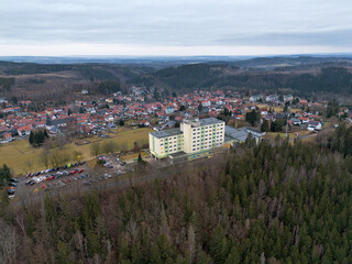 Fototapeta premium Friedrichroda in Thuringia on the Rennsteig mountain in autumn, drone shot
