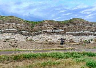 The layered hills and hoodoos show geological history at Drumheller, Alberta
