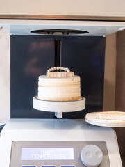 Dental crown sintering process in high temperature furnace, zirconia ceramic prosthetics being fired in dental lab for final hardening and strength.