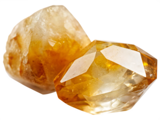 Two yellow crystal gemstones on white background isolated on a transparent background