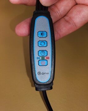 Delaware, U.S - Dec 15, 2025 - Plant grow light control switch with timer settings of 6-hour, 9-hour, 12-hour, and brightness, mode, and power buttons for indoor gardening.