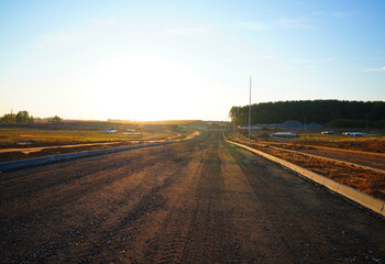 Asphalt road after asphalt laying. New asphalt, road renovation. Road construction. Paved highway....