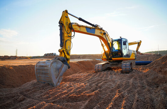Excavator earthworks on construction site.  Sewer Line Repair. Excavator groundwork Water Line Repair. Backhoe earthmoving. Earthmover. Excavator dig trench for Replacement sewage. Water Line Repair.