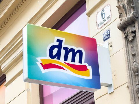Zagreb, Croatia - December 14, 2025: dm brand store sign displayed on colorful background, showcasing vibrant logo and inviting atmosphere for shoppers in urban setting