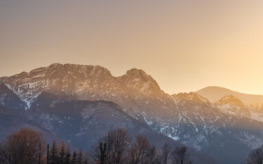 Giewont peak in Tatra Mountains above Zakopane town in Poland, Europe. An abstract landscape is created through a grid of colorful blocks that obscure and reveal natural imagery fragments.