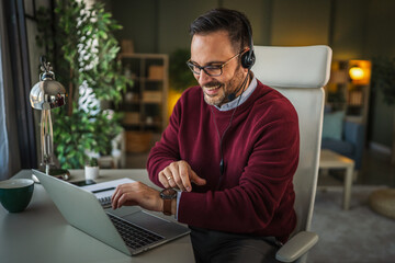 Man using headset while working from home