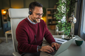 Man using headset while working from home