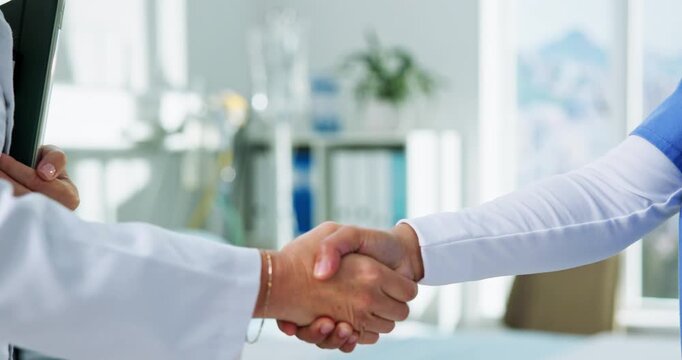 Handshake, partnership and doctors with woman in hospital for medical checkup together. Discussion, shaking hands and professional healthcare employees with welcome, thank you or support in clinic.