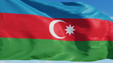 The vibrant national flag of Azerbaijan proudly waves in the gentle breeze against a clear blue sky symbolizing the rich history independence and cultural heritage of the Azerbaijani nation.