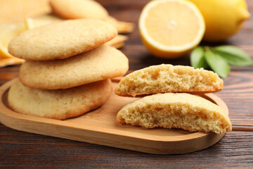 Tasty lemon cookies on wooden table, closeup
