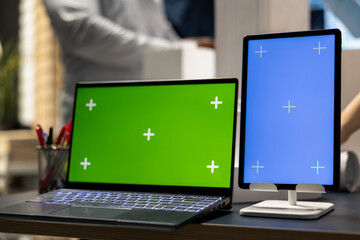 Close up of mockup copy space laptop and tablet in an office, residential project planning in a meeting between real estate contractors to discuss rules and zoning regulations. Urban development.