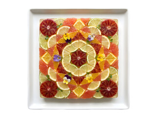 Vibrant and Colorful Fruit Arrangement Showcasing Citrus and Flower Decorations for a Delightful Presentation