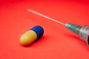 Transparent medical syringe with needle and pill