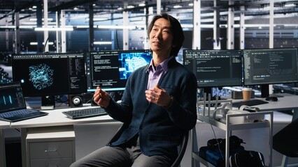 Smiling data center manager filming presentation, showcasing equipment using AI tech. Happy businessman presenting server room built for digital storage systems using artificial intelligence, camera A
