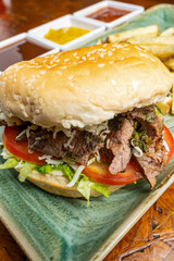 Grilled Chicken Sandwich with Melted Cheese, Lettuce and Tomato on Toasted Bun, Close Up Food Photography