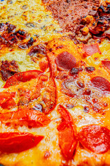 Close-up of a slices of Diverse Pizza Varieties on Checkered Paper