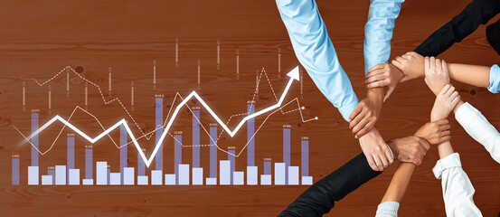 A diverse team collaborates over data analysis to drive business growth. Hands join together, symbolizing unity and motivation towards achieving innovative success. Scalp