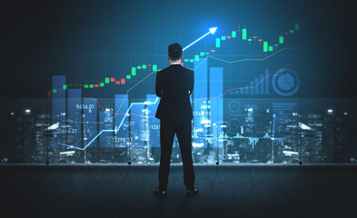 A businessman stands in front of a large screen displaying stock market trends and data. The modern office offers a stunning city backdrop, inspiring the process of financial analysis. Scalp