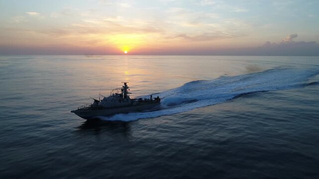 Israeli Navy Saar Missile Boat on high speed at Sunset

Israeli Navy Saar class missile boat sailing calmly during sunset over open sea, Israel, November 2025.
