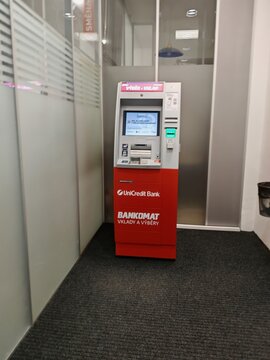 Prague,Czech Republic-14.01.2026: Automated teller machine of UniCredit Bank providing cash withdrawal and basic banking services for clients in public urban space