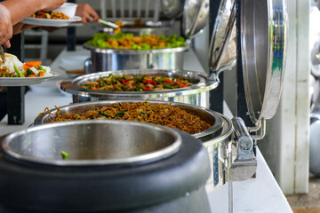 Taking food in buffet banquet catering feast food, various food menu on the display
