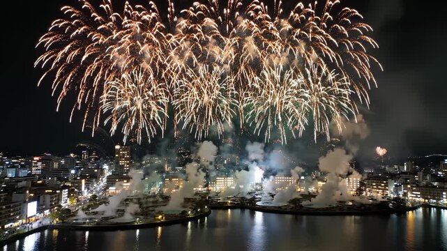 Fireworks Exploding Over Beppu Onsen Town, Japan at Night