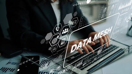 Professional creating digital data mesh concept using laptop with modern technology and graphics in a contemporary workspace. Asymptotic smart data analytic.