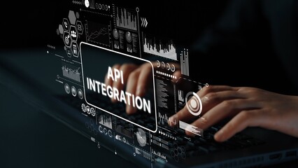 Hands Typing on Laptop with API Integration Concept and Data Visualization Elements in Background. Asymptotic smart data analytic.