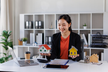 Real estate agent talked about the terms of the home purchase agreement and asked the customer to sign the documents to make the contract legally, Home sales and home insurance concept.

