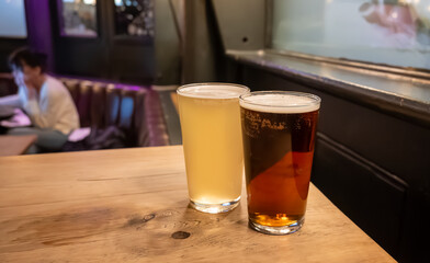 Classic London pub crawl with friends, enjoying cask ales and lively atmosphere of traditional...