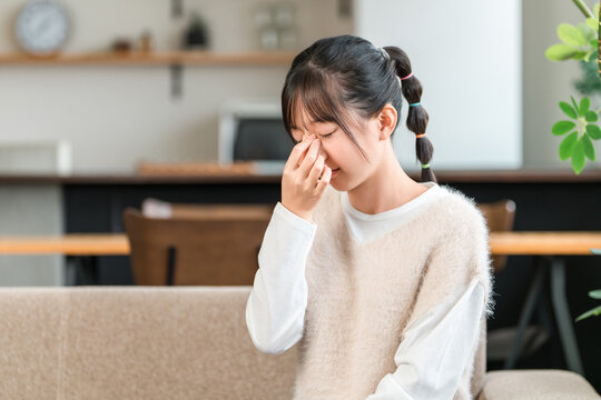 Elementary and junior high school girls suppressing eye strain