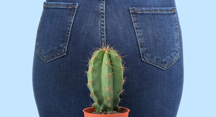Woman and cactus on light blue background, closeup. Plant with needles symbolizing painful symptoms of hemorrhoids © New Africa