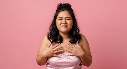 Fototapeta premium Overweight Asian woman feeling grateful and touched.