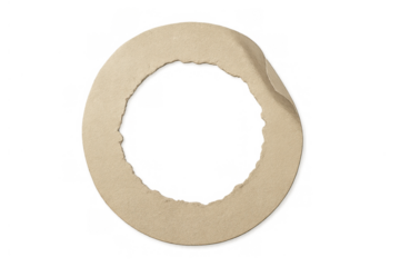 Torn paper circle ring with rough edges and curled corner representing frame element on transparent background