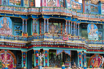 Decorative exterior details of a hindu temple in Matale, Sri Lanka. Colorful sculpted ornaments, traditional carvings and religious symbols showcasing South Asian spiritual architecture.