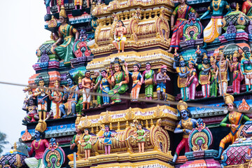 Decorative exterior details of a hindu temple in Matale, Sri Lanka. Colorful sculpted ornaments, traditional carvings and religious symbols showcasing South Asian spiritual architecture.
