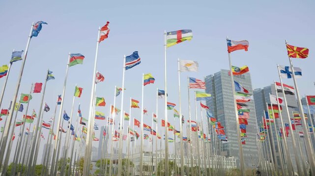 Aerial View of International Flags in Modern City Square