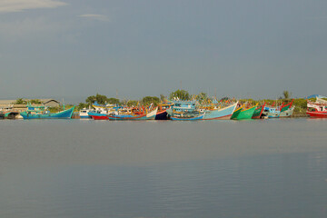 Colorful Fishing Boats in Tranquil Waters Stunning Seaside Landscape