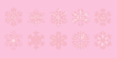 Delicate white snowflakes arranged on a soft pastel pink background