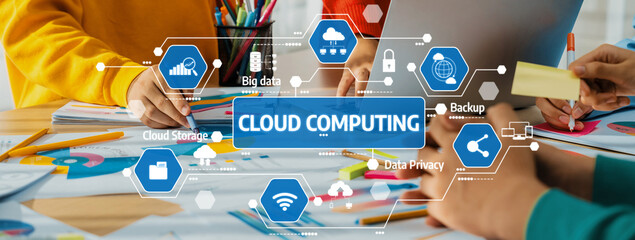 Dynamic workspace showcasing hands engaged in discussions about cloud computing, featuring colorful stationery and technology icons representing modern business concepts. Amity