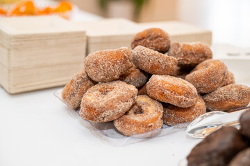 Stack of delicious fresh donuts on a plate 